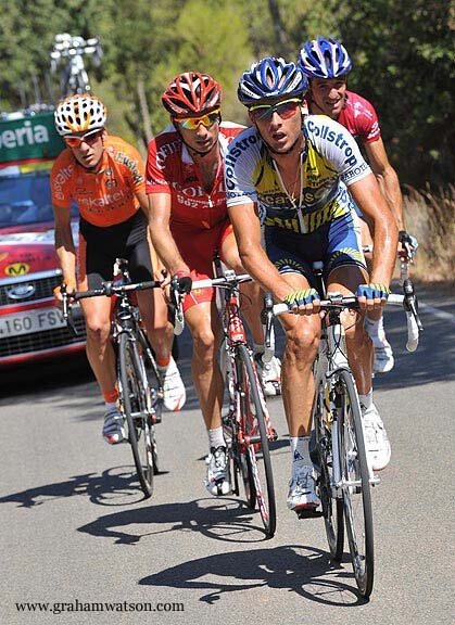 David Moncoutié of Cofidis being closely marked by David de la Fuente in the claret jersey of King of the Mountains on Stage 11 of the 2009 Vuelta.